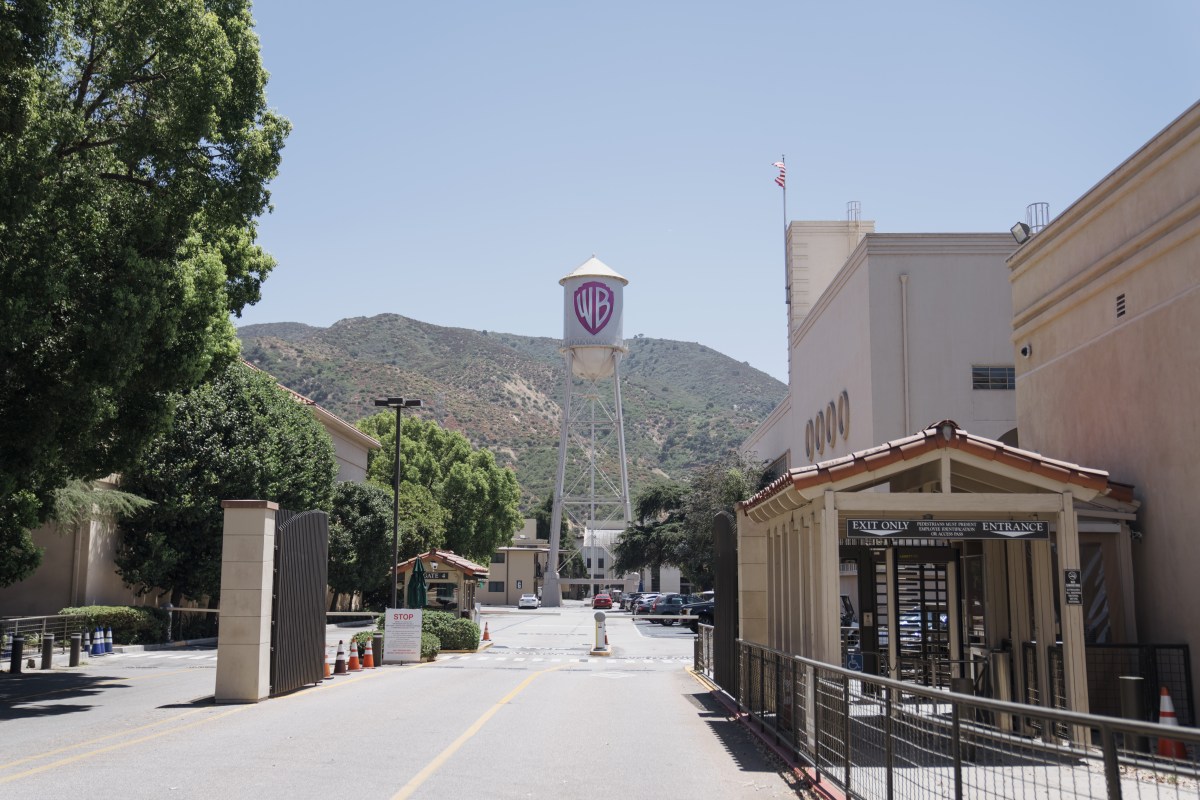 Corporate logos for Warner Bros Discovery and Paramount during their merger announcement